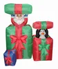 150cm/5ft inflatable santa claus and penguin on the up and down gift bag behind a small git bag