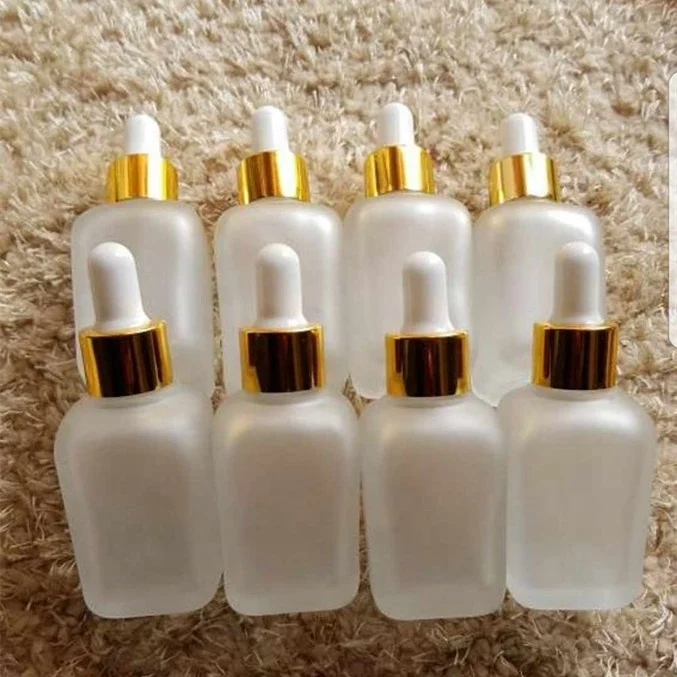 
Fancy square 15ml 20ml 30ml 50ml 100ml 30 ml clear frosted clear perfume glass dropper bottle with gold hollow caps  (60736370832)