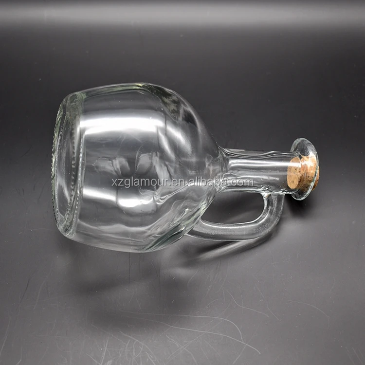 
clear glass pot dispenser with bird beak for olive oil or vinegar 