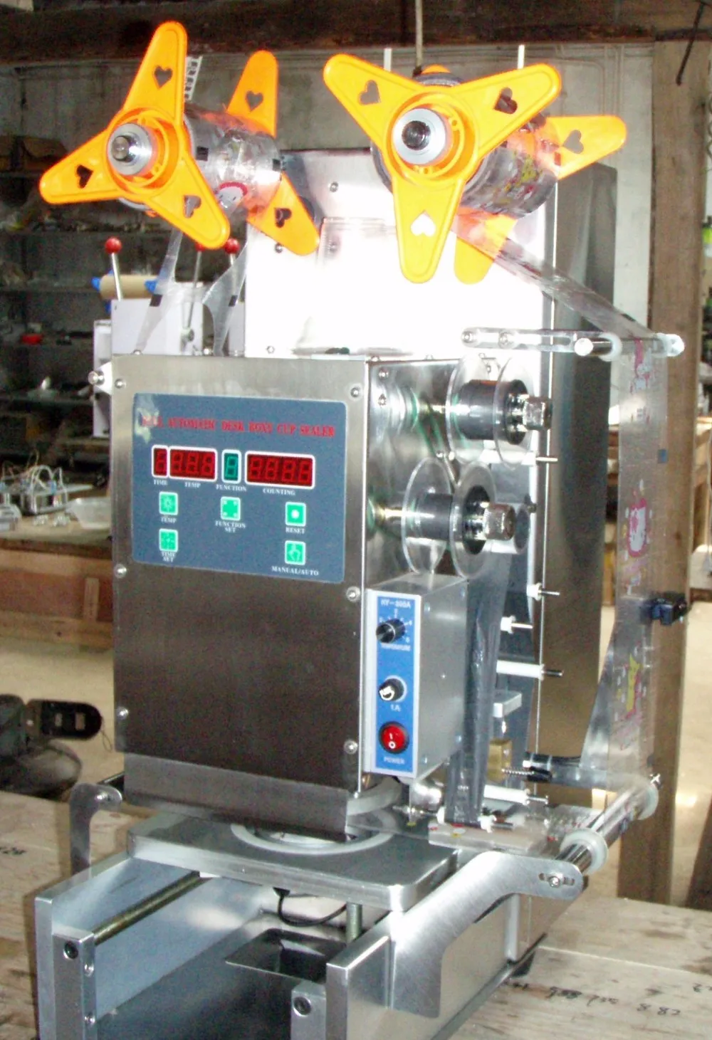 auto sealing machine with ribbon code printer 