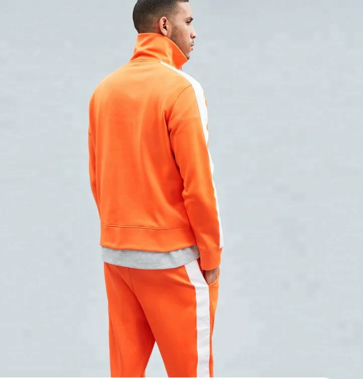 orange and white jogging suit