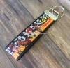 Latest modern fashion custom printing cotton English webbings cartoon key chain for bag