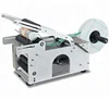 Manual round bottle labeling machine for small business/sticker labeling machine for PET/glass bottle