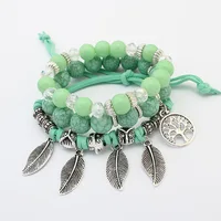 

Yiwu Wholesaler Handmade Antique Plated Pack of 3 Zinc Alloy Tree of Life and Leaves Charm Glass Acrylic Bead Bracelet Women