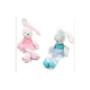The baby sleeps with a stuffed rabbit doll plush toy
