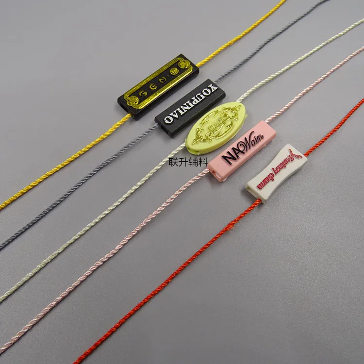 

5000pcs plastic seal tag for hang tag custom made own design plastic seal tag aluminium seal tags garment hangtag string