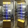Luxury store floor standing Rotating Hexagonal glass display showcase/Tower showcase display/acrylic showcase design