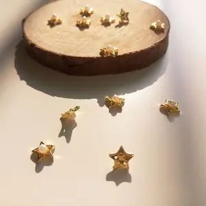 Wholesale gold five pointed star metal alloy nail art with pearl mix designs nail decoration for DIY 3D nail art supplies
