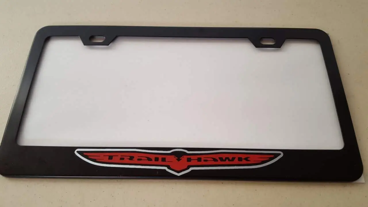 Jeep Trailhawk Red Vinyl Decal Cut on Black Metal License Frame with matching color screw caps