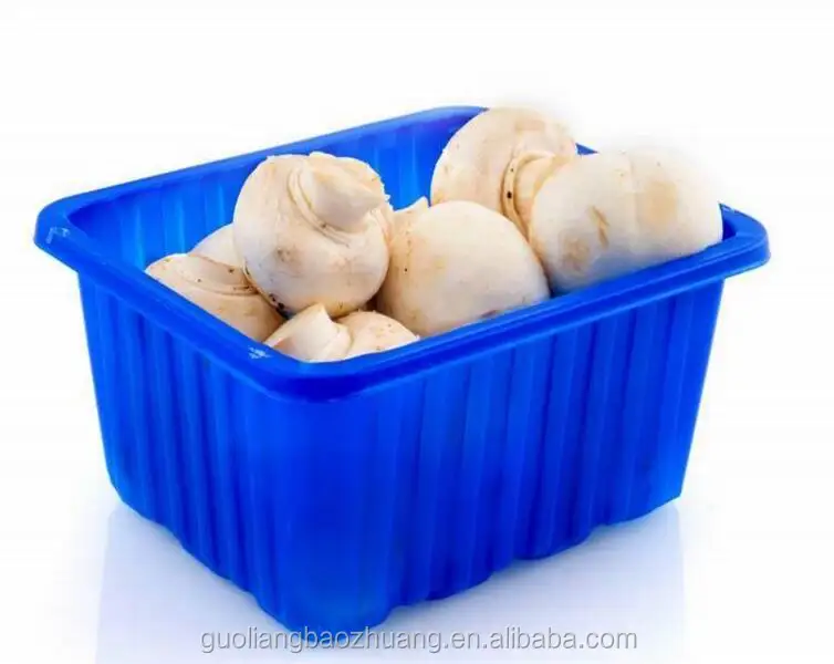 Prepacked mushrooms in a punnet covered with clear plastic