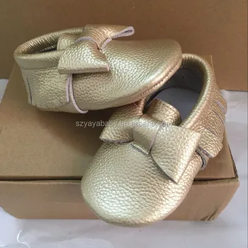 gold branded baby shoes