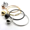 Stainless steel hanging light hollow ball funky bangle