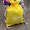 Printed yellow polyester drawstring pouch with towel lining