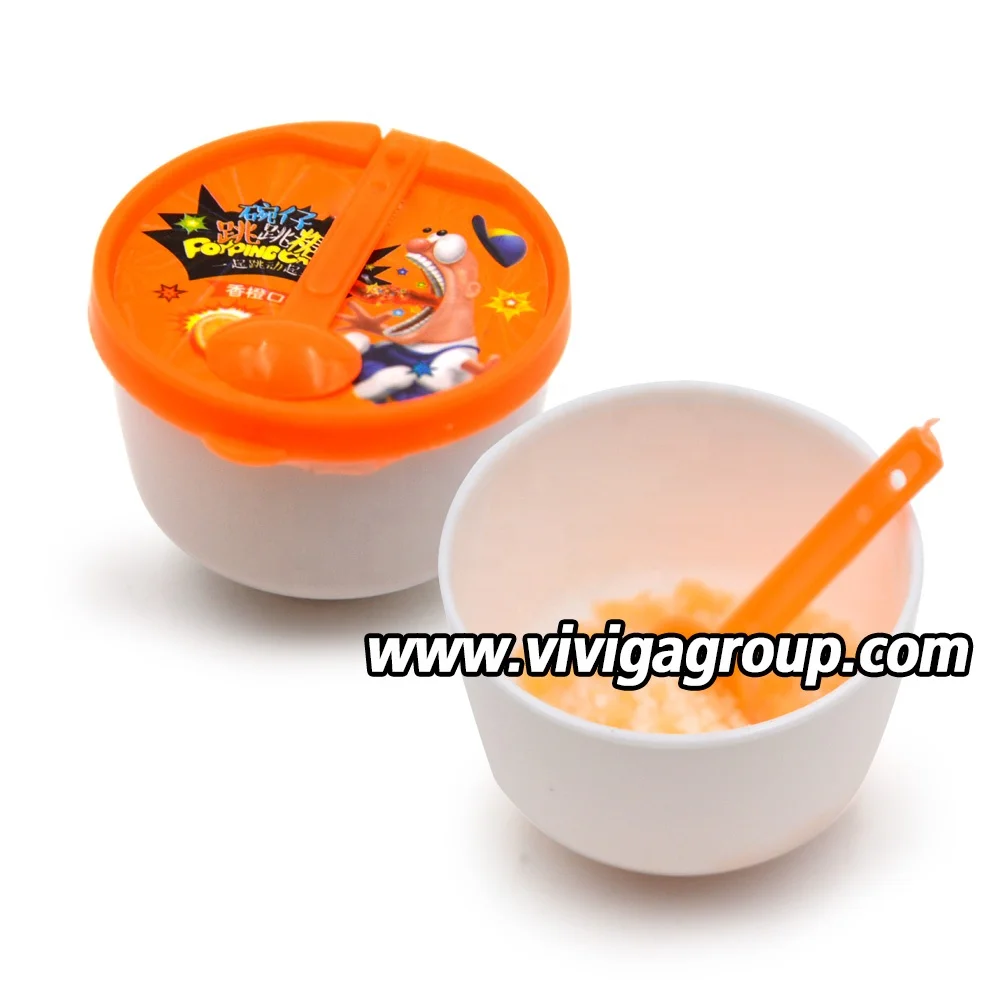 
mini bowl shaped spoon toy with fruit orange flavor popping candies 