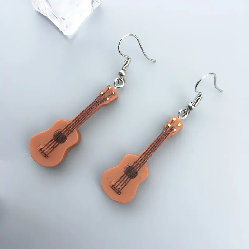 

Hainon April new earrings for women Creative personality punk small guitar shape dangle earrings wholesale, Color