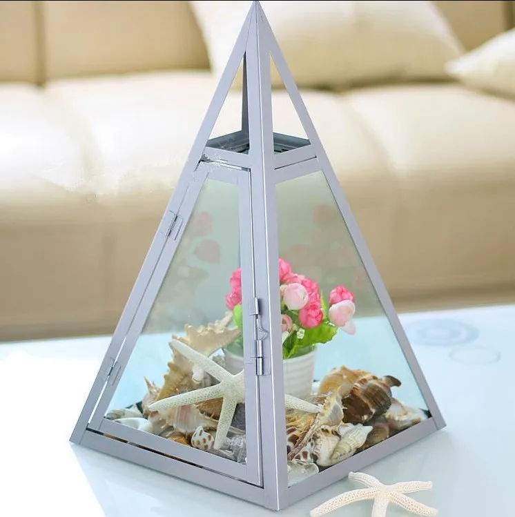 big grey pyramid shape metal and glass display box geometric