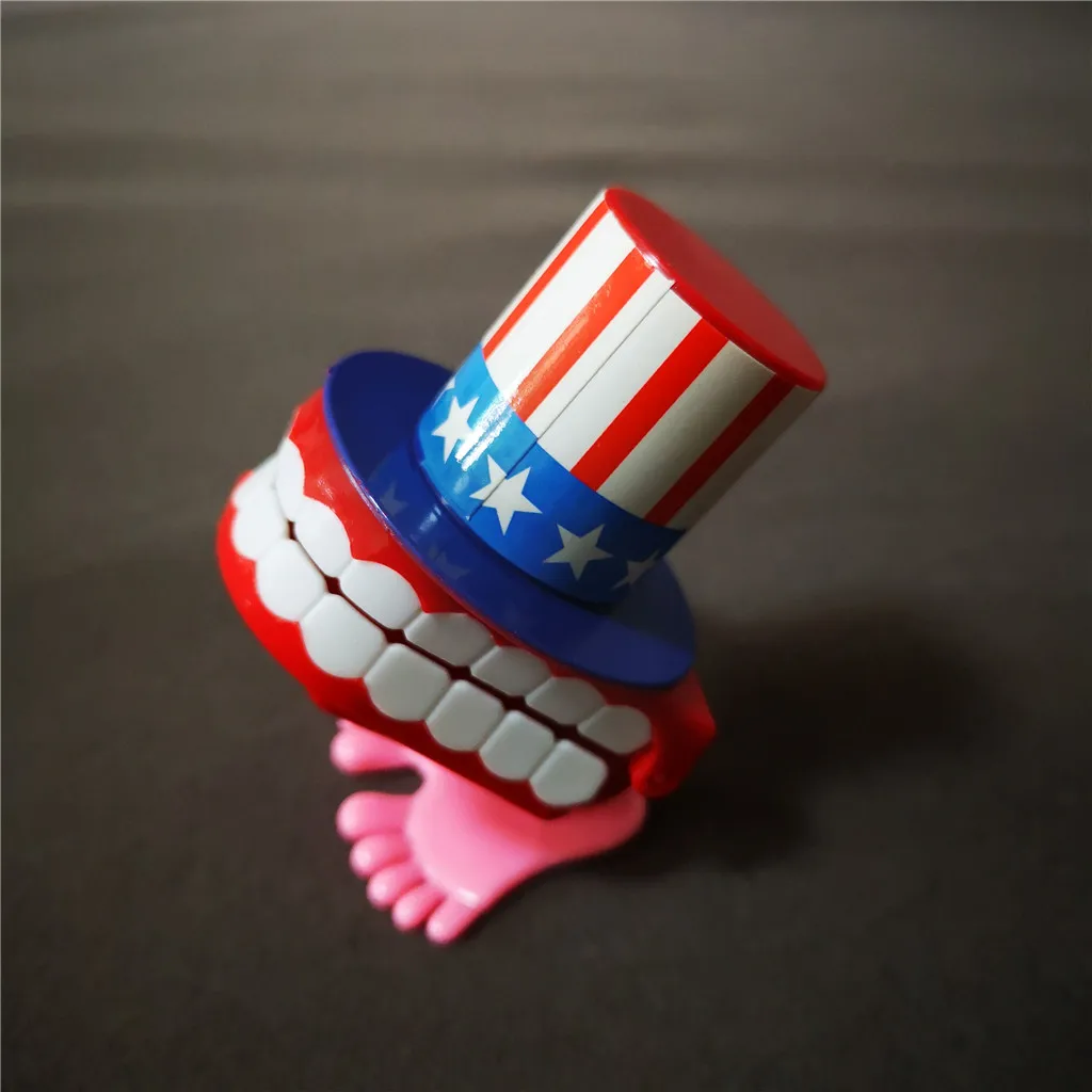 Jumping Wind up chain red lips teeth with hat Dancing toys