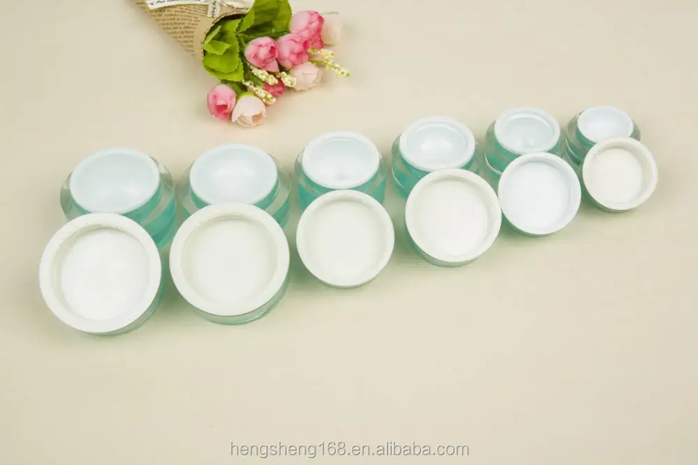 green cosmetic cream jars