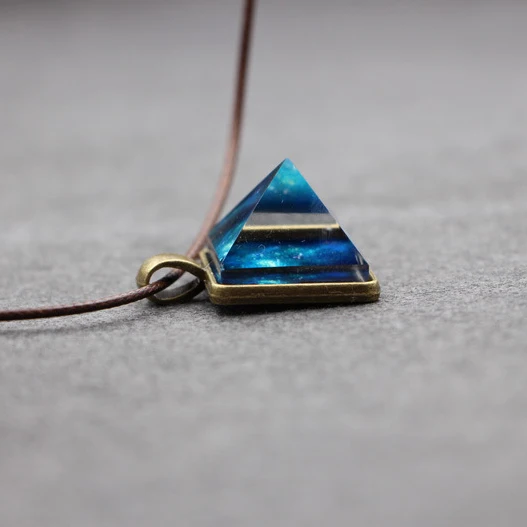 

2017 Glowing Crystal Glow in the Dark Pyramid Pendant Outer Space Star Dust Necklace Triangle Geometric Magic Necklace, 7 colors