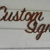 Custom made rusty metal house signs