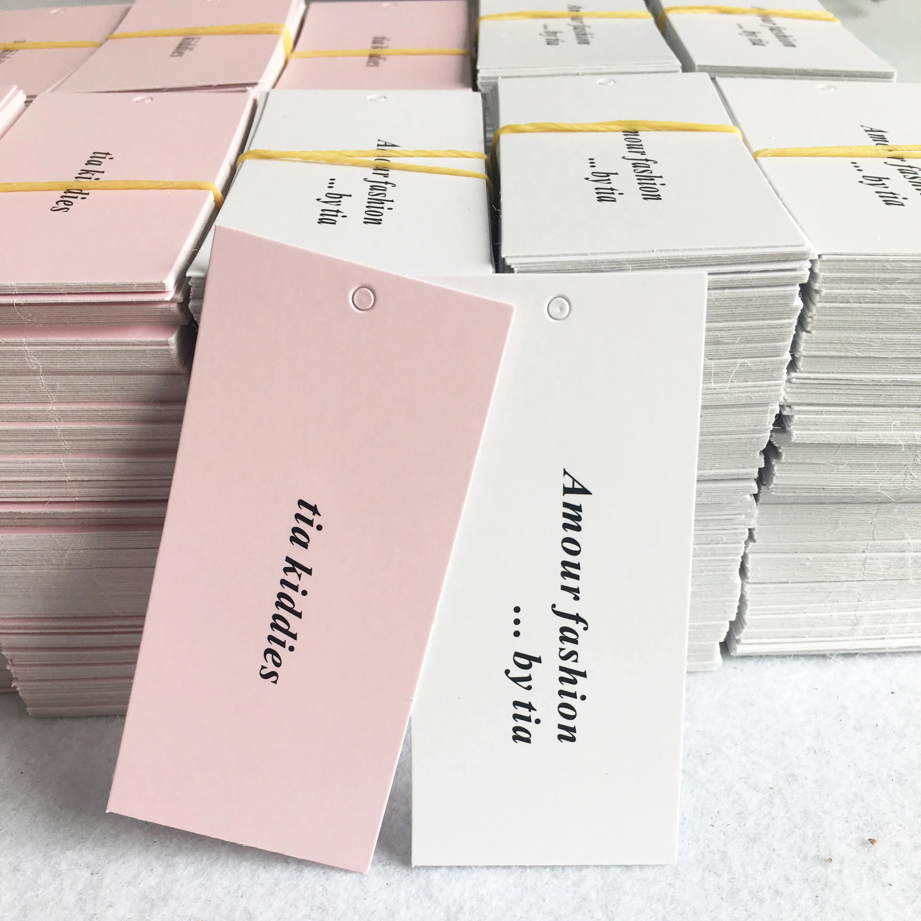 

Low price custom brand coated paper pink printing swing tag hang tags, Cmyk