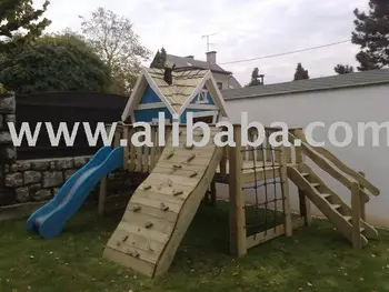 outdoor playhouse with climbing wall