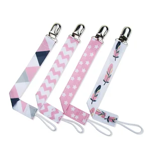 Image of baby feeding pacifier clip ribbon and metal pacifier holder