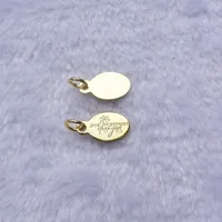 

yellow gold logo engraved jewelry tags charms custom made metal logo charms company logo stamped jewelry charms