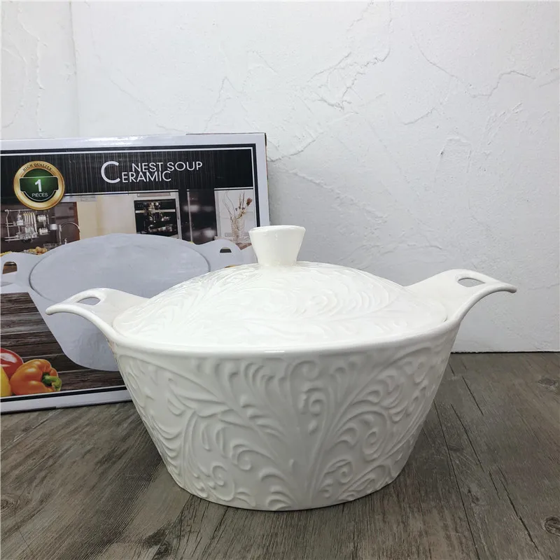 
white porcelain round ceramic soup tureen with embossed decoration and two handles 