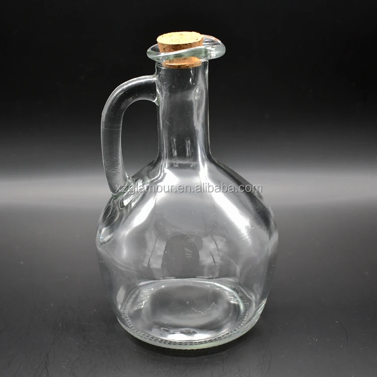 
clear glass pot dispenser with bird beak for olive oil or vinegar 