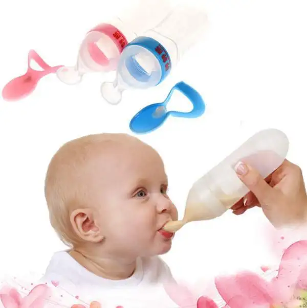 baby feeding bottle with spoon attached