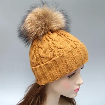 winter hat with fur ball on top