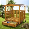 Outdoor wooden big sandbox with roof and veranda