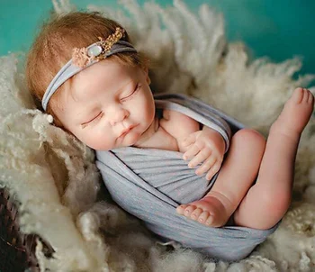 newborn photography posing doll