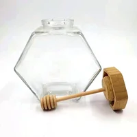 

Customized 220ml 380ml Hexagon glass honey jar food grade glass storage jar with wooden lid and wooden dipper