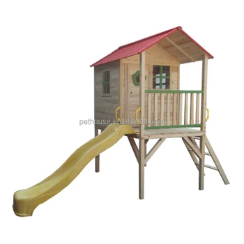 outdoor wooden playhouse with slide