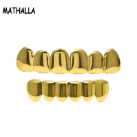 

Best Hiphop Jewelry Gold Plated Teeth Grillz Set Plain Teeth Top Bottom Slugs High Quality Grillz Set with Molding Bar