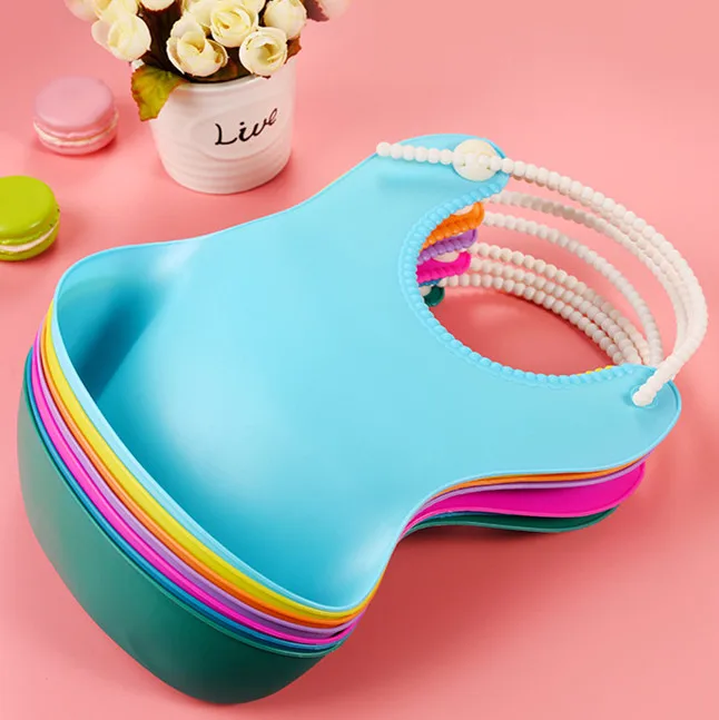 

Hot sale TPE waterproof Baby bibs Environmentally friendly with feeding pocket