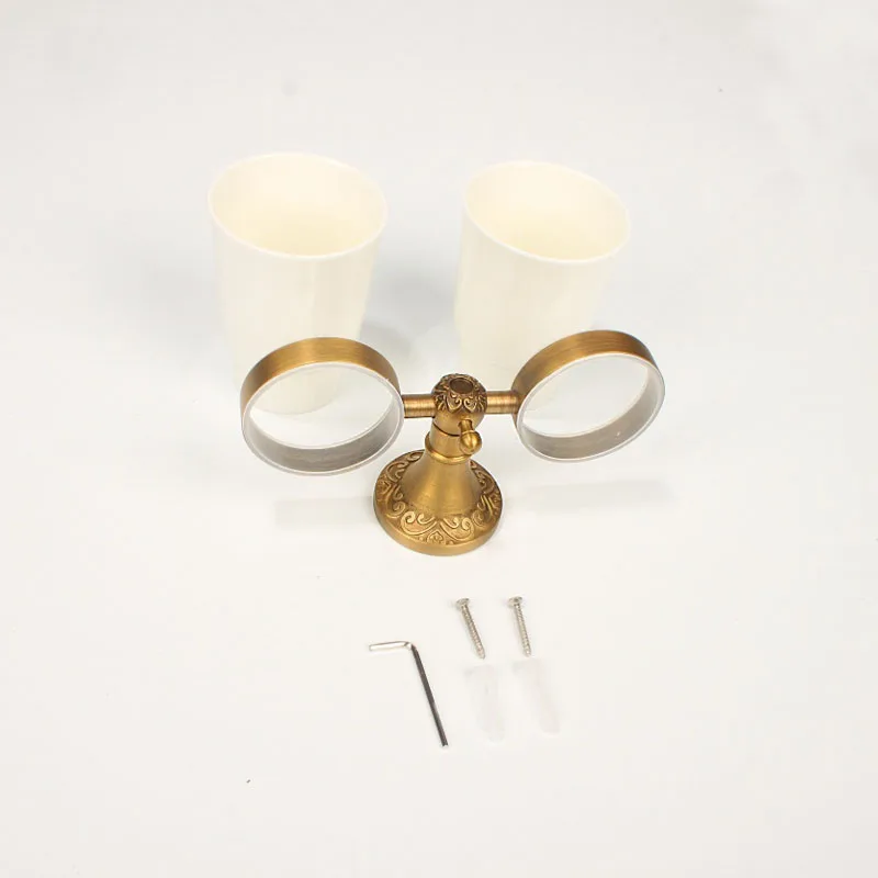 
double antique brass wall mounted cup holder for holding bathroom tool 