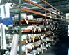 Teardrop Style Pallet Rack With Solid Metal Decking Used To Store Textile Rolls
