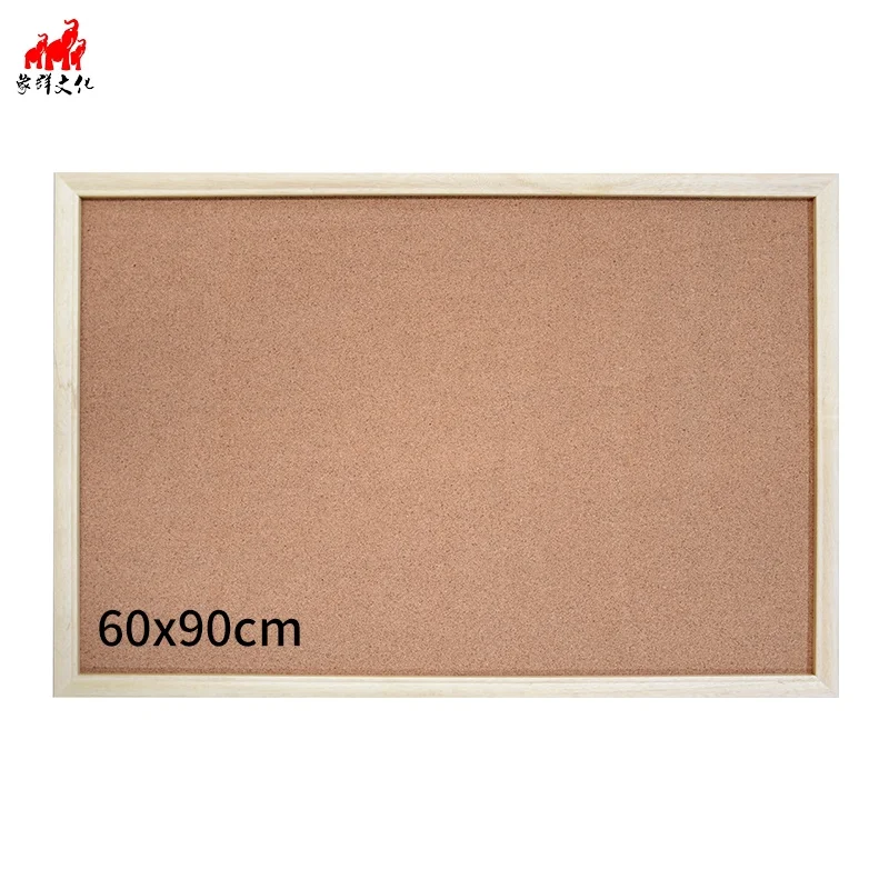 
Staples cork board with wood color frame on wall for sell 