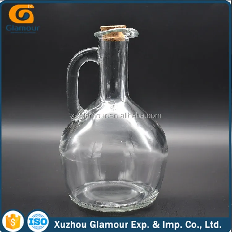 
clear glass pot dispenser with bird beak for olive oil or vinegar 