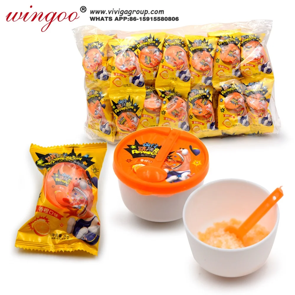 
mini bowl shaped spoon toy with fruit orange flavor popping candies 
