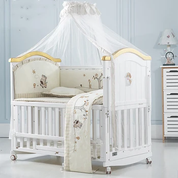 wooden cot with mosquito net