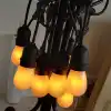 Outdoor holiday decoration LED cream white Edison lamp orange light source flame lamp string