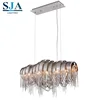 Postmodern shadow lamp arched aluminum chain tassel chandelier lighting for hotel