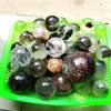 Wholesale hand carved small natural green ghost phantom crystal healing ball/sphere for decoration