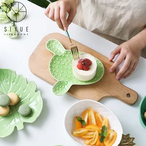Image of new designed ceramic material colorful leaf shape fruits plate