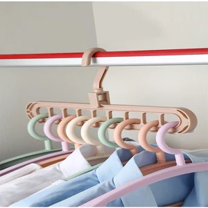 Image of China nine-hole 360-degree revolving magic hanger multi-functional folding magic hanger wardrobe airing clothes hanger