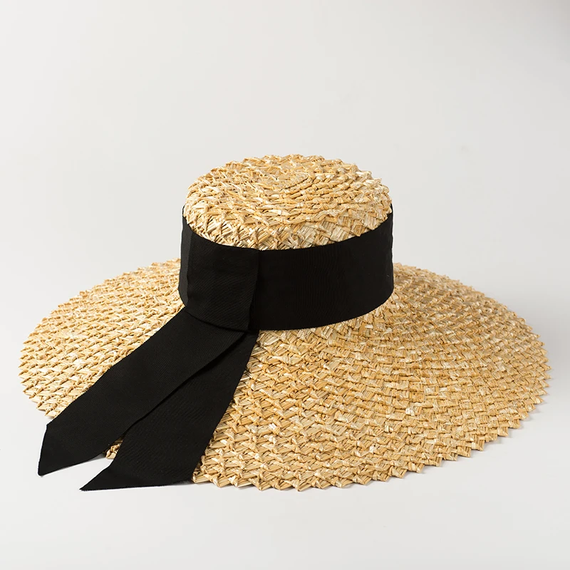 

Wide brim natural straw flat top bucket hat with ribbon band